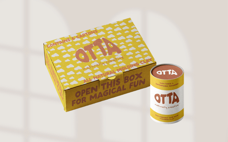 Growth Story branding; how to launch a new brand images Image shows the box and tube packaging for a children's brand called Otta. It is a distinctive package that grabs your attention with bright yellow and terracotta colors. The slogan "naturally creative" is written in a custom handwritten font. The box also says "open this box for magical fun."