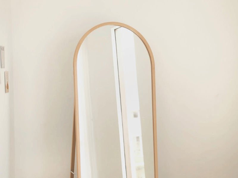 A mirror in a brightly lit room