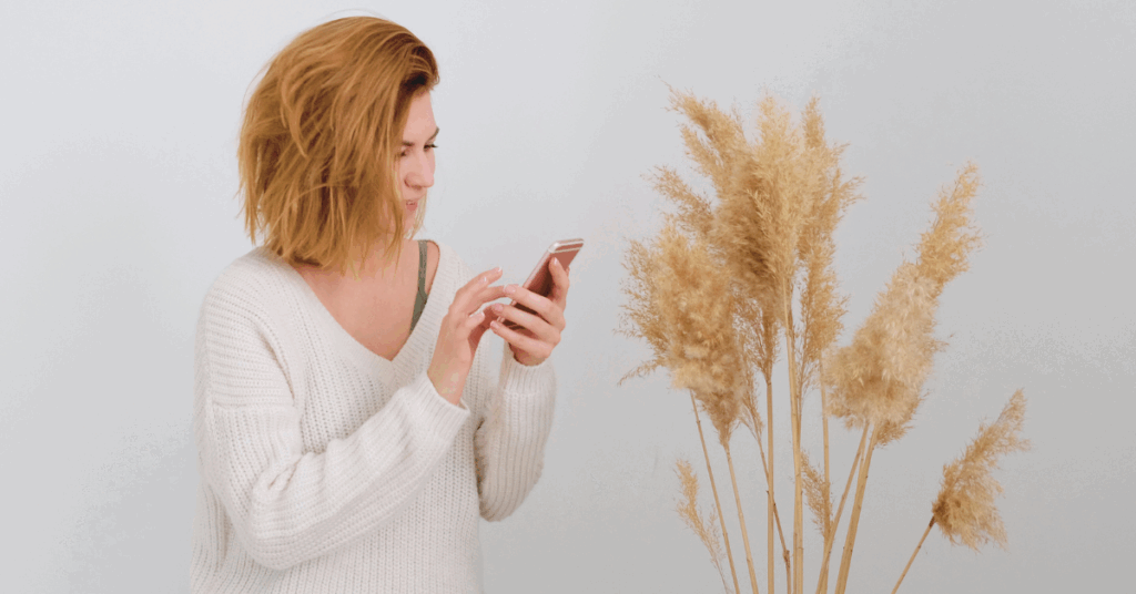 a woman scrolls on social media