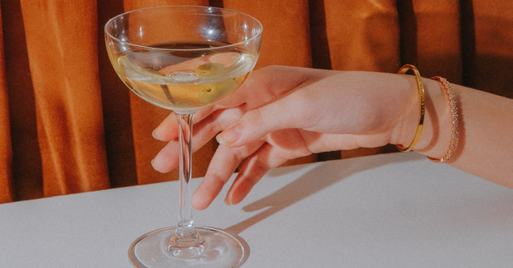 visionary pages featured image - chapter 1 how will you tell your growth story, a woman reaches for a martini