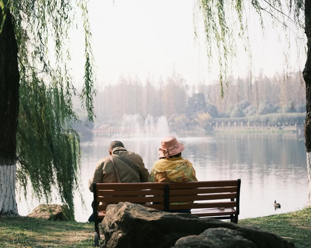 two people enjoy a pond symbolizing the peace of mind financial storytelling can evoke